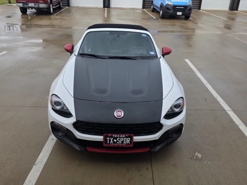 Front view of a white sports car with a clean glossy finish
